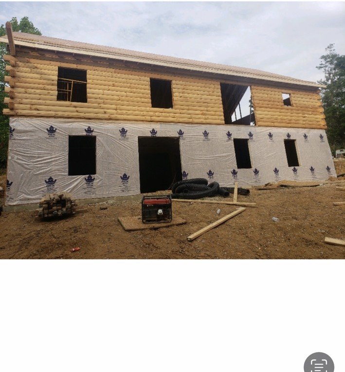Two-story log home project under construction